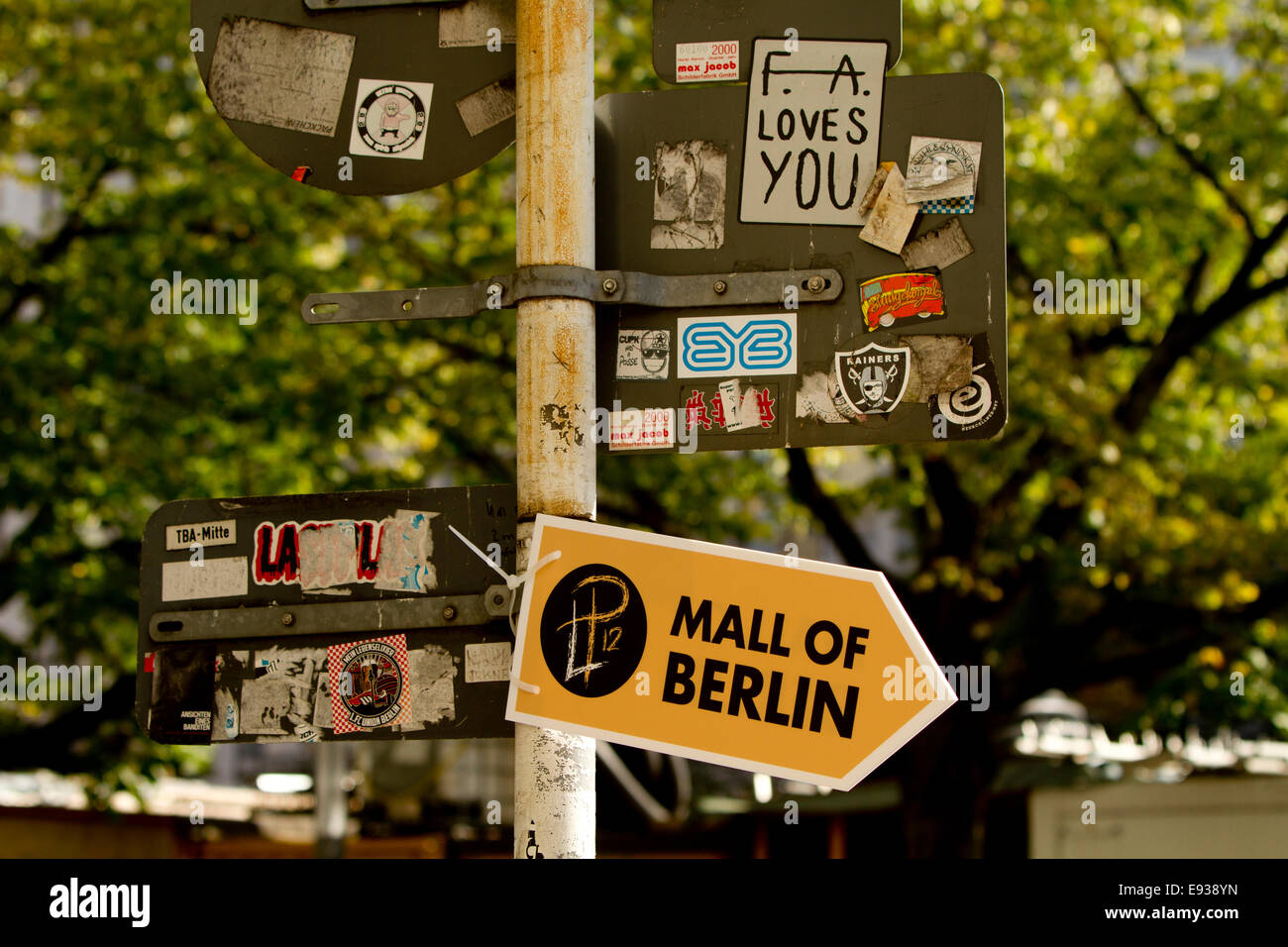 Street sign sign post Berlin stickers grafitti Stock Photo