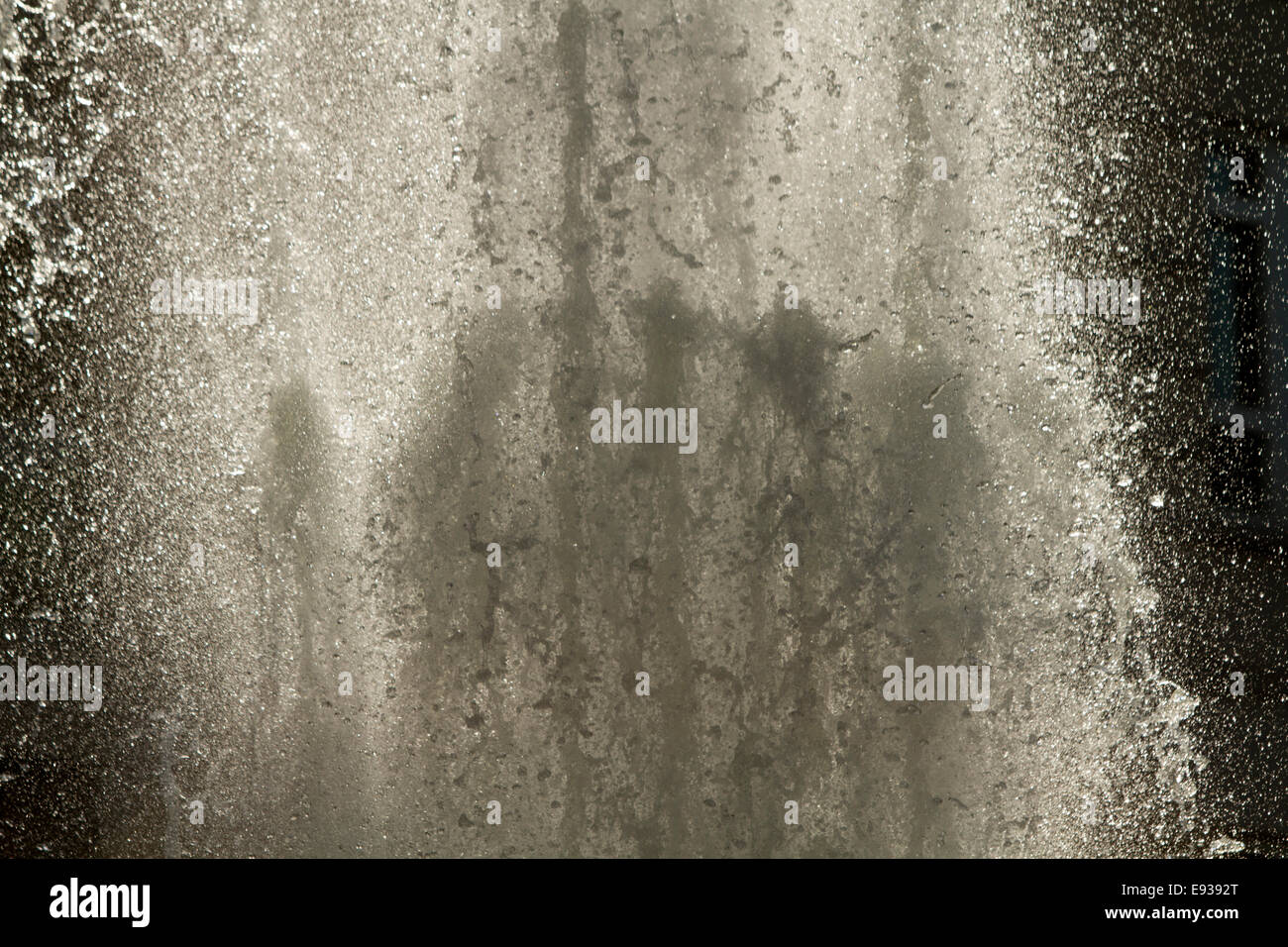 Back lit fountain close up of water droplets jet Stock Photo