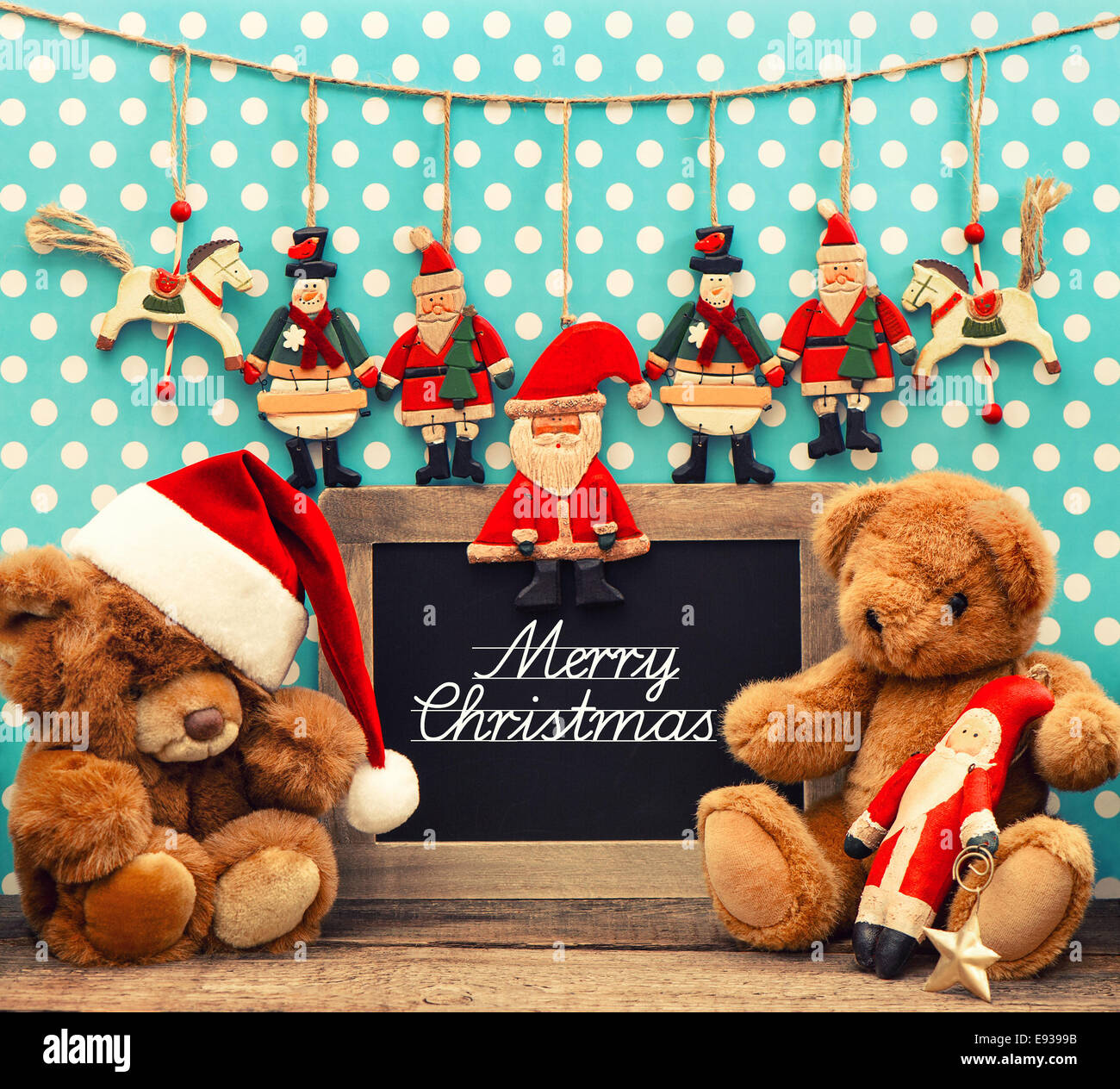 nostalgic home christmas decoration with antique toys. vintage arrangement  and blackboard with sample text Merry Christmas Stock Photo