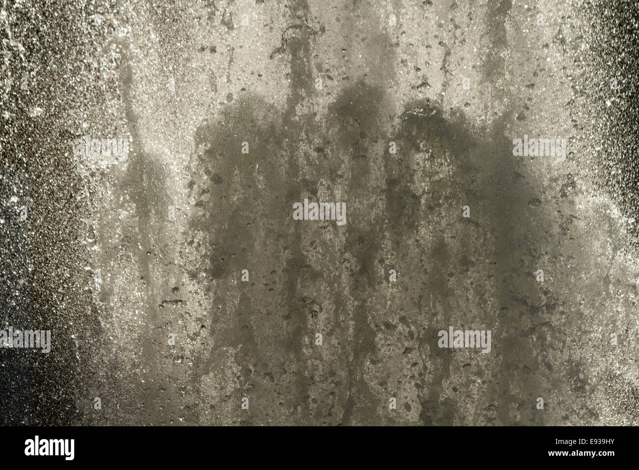 Back lit fountain close up of water droplets jet Stock Photo