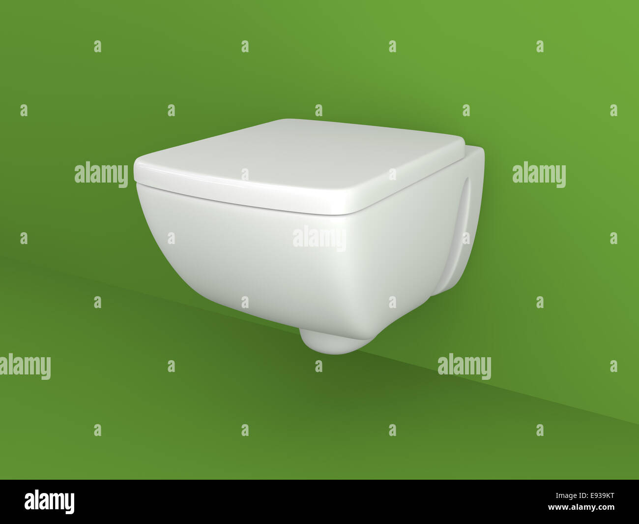 Toilet appliance on green wall. Stock Photo