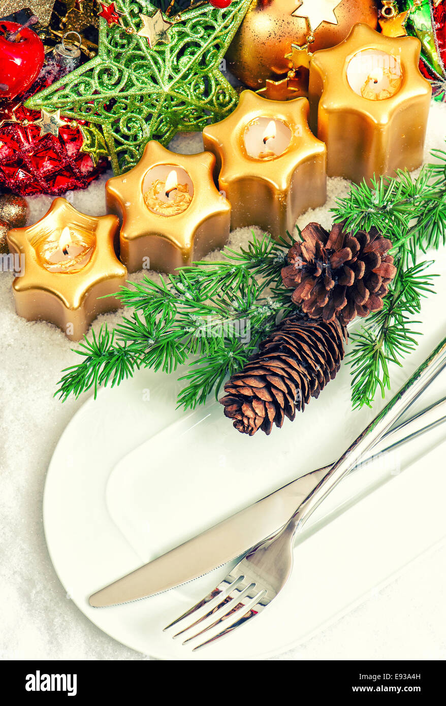 Christmas dinner table decoration with pine branches and golden cones.  Christmas centerpiece with golden decor. Christmas party Stock Photo - Alamy
