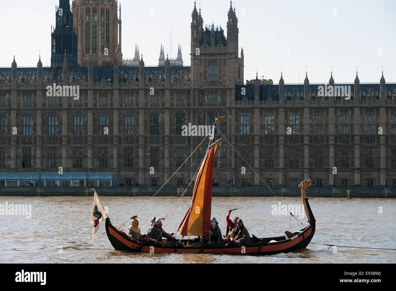 A crew of Vikings arrive in a replica Viking boat on the River Thames