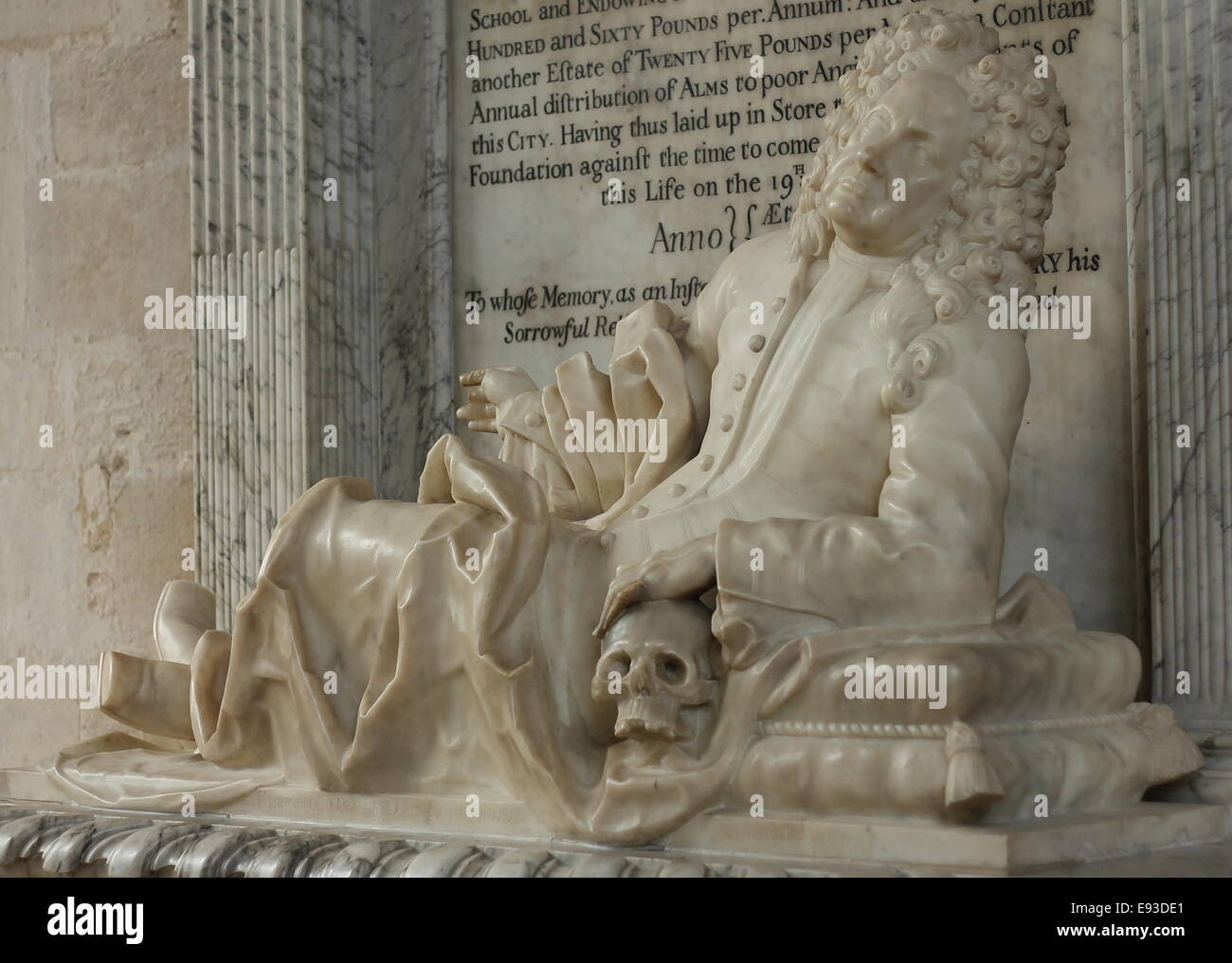 tomb-featuring-a-statue-of-a-reclining-man-resting-on-a-skull-stock