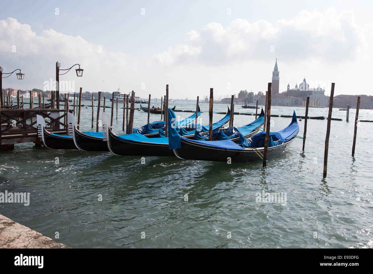 venice four blue gondola 2 Stock Photo - Alamy