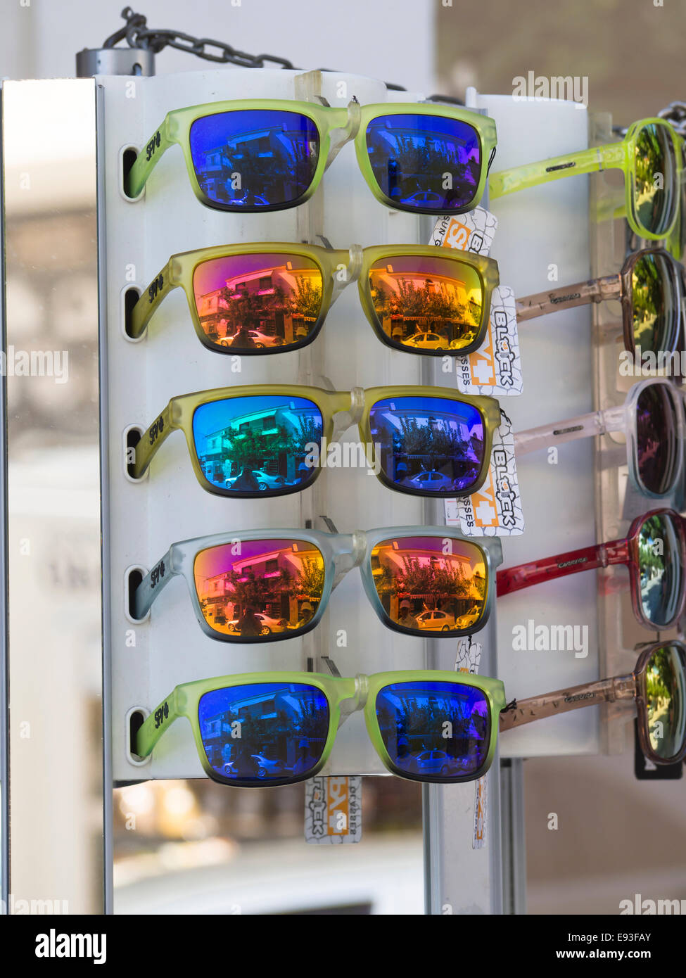 Summer vacation impressions, colourful sunglasses with reflective surface coating on display stand in a shop in Samos Greece Stock Photo