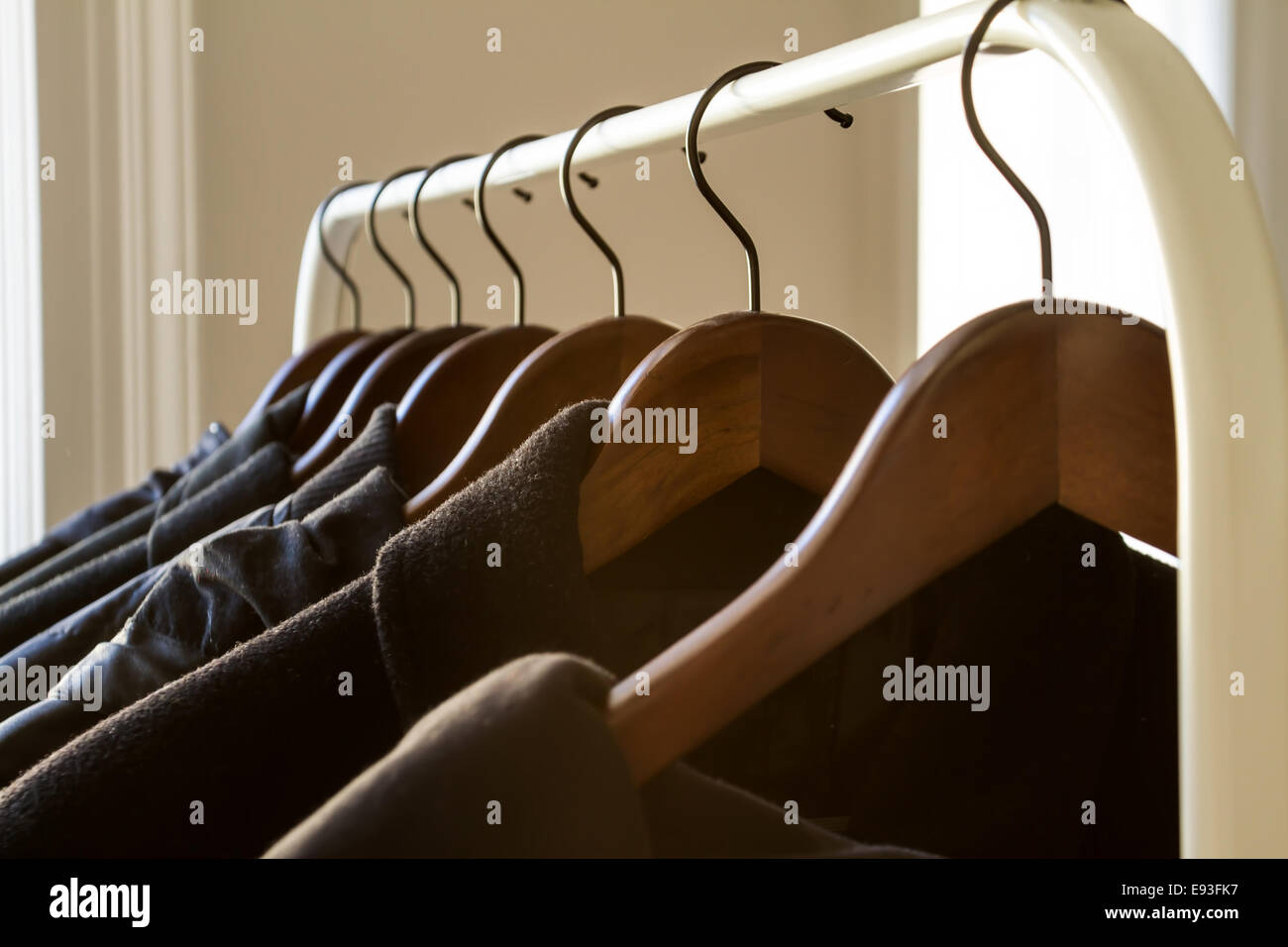 Winter clothes hanged on a clothes rack Stock Photo