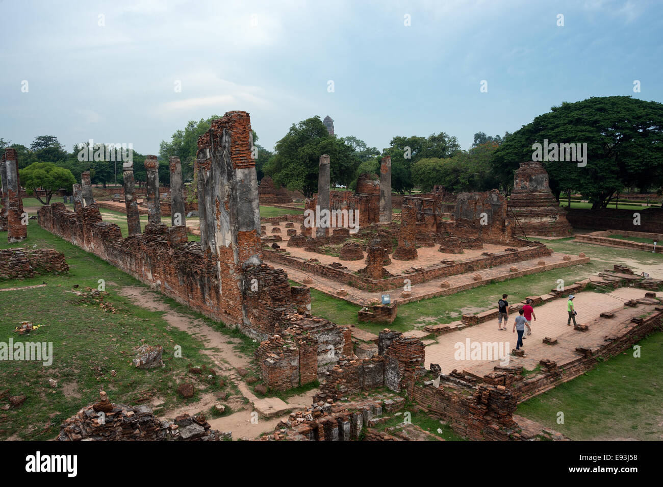 Tourists walk through the famous ruins at Wat Phra Si Sanphet in Ayutthaya, Thailand Stock Photo