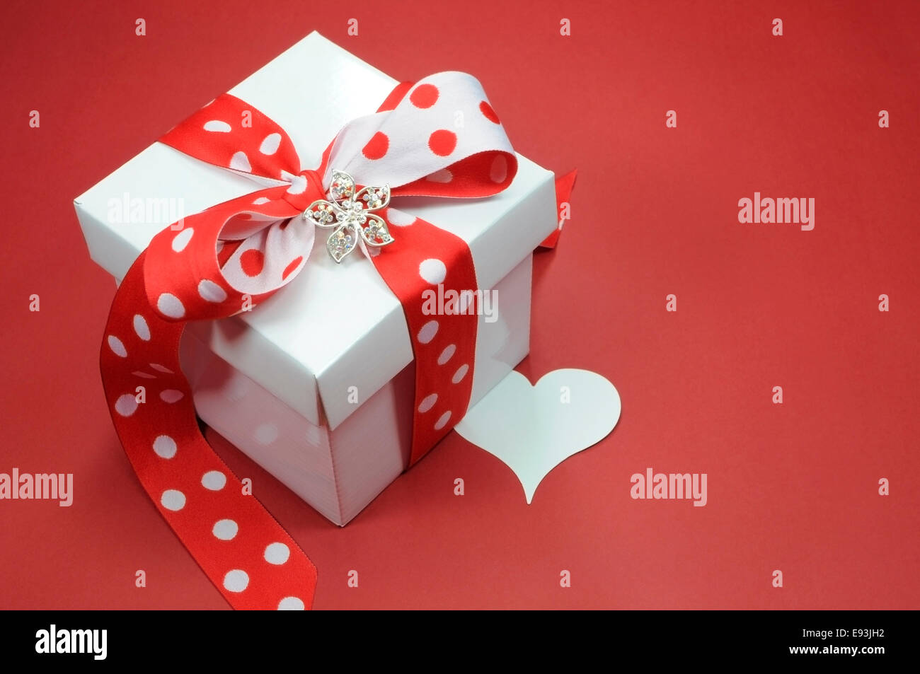 Red and white polka dot theme gift box present with heart shape gift ...