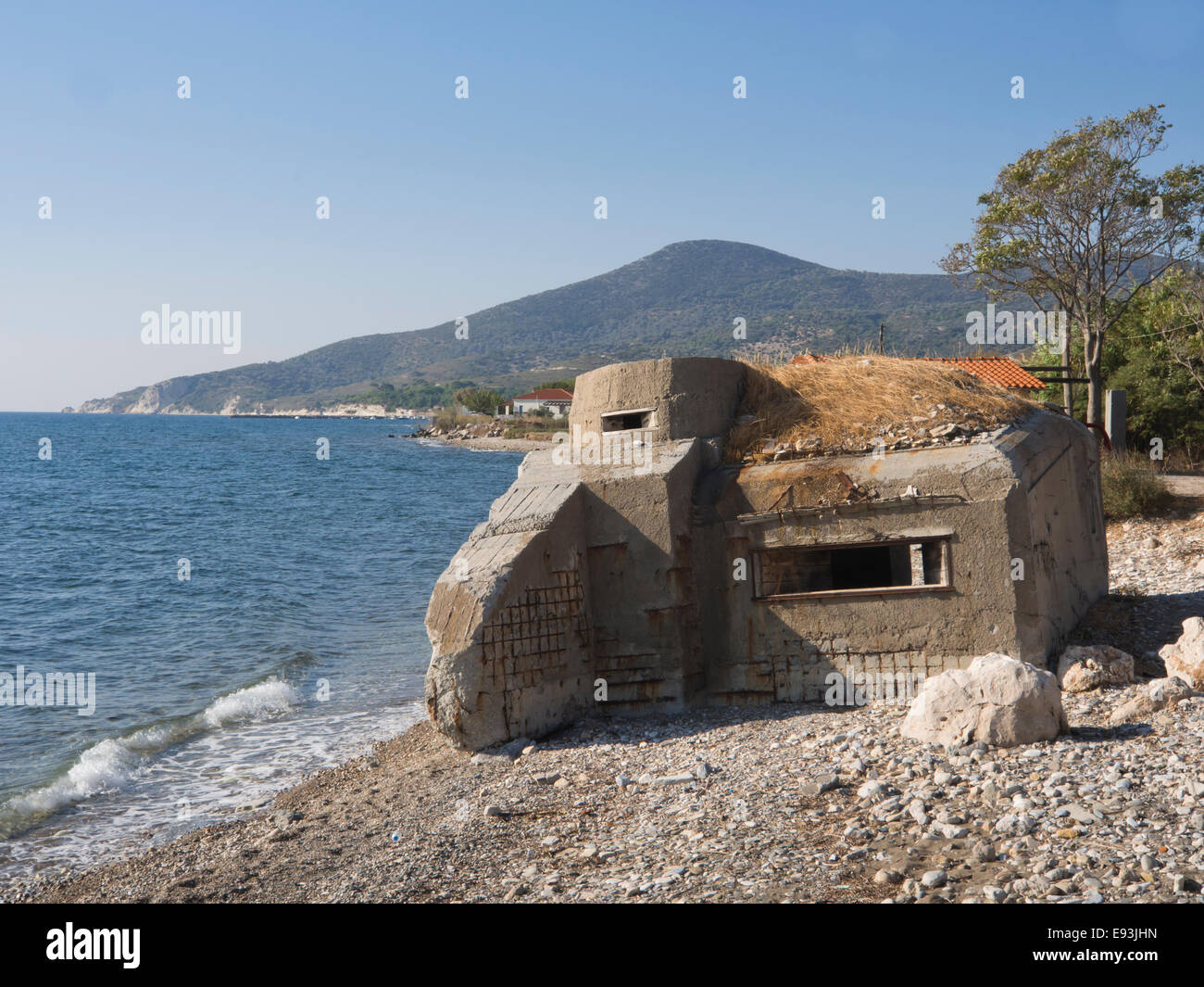 Wartime bunker on the beach of the island of Samos in Greece, ruin of defense line Stock Photo