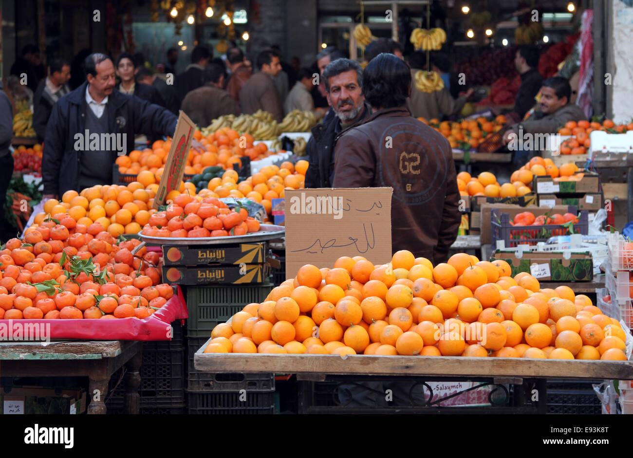 Orange sellers at the fruit market in downtown Amman, Jordan Stock Photo