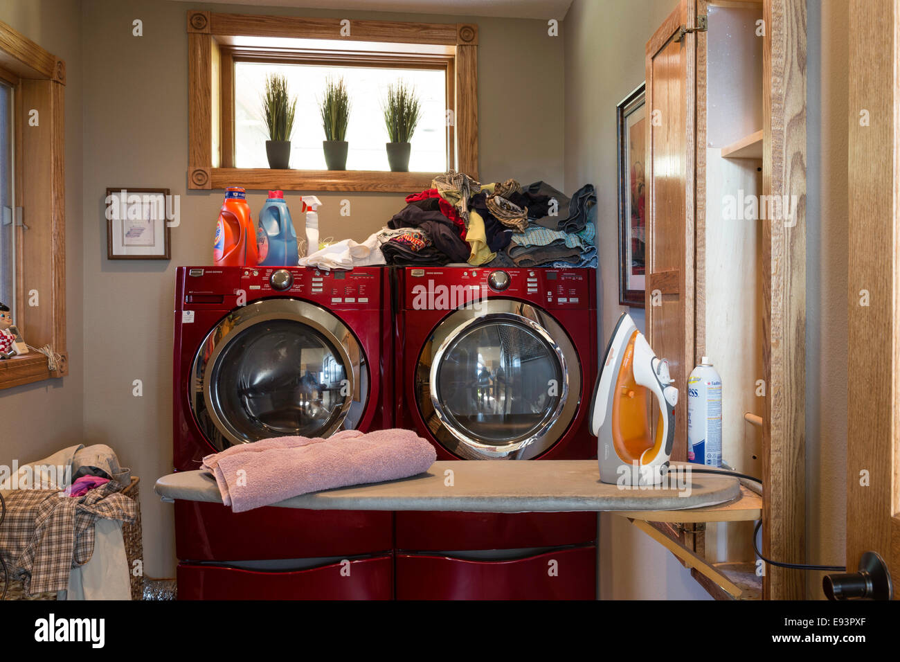 Residential Home Laundry Room With Modern Front Loading Washer And