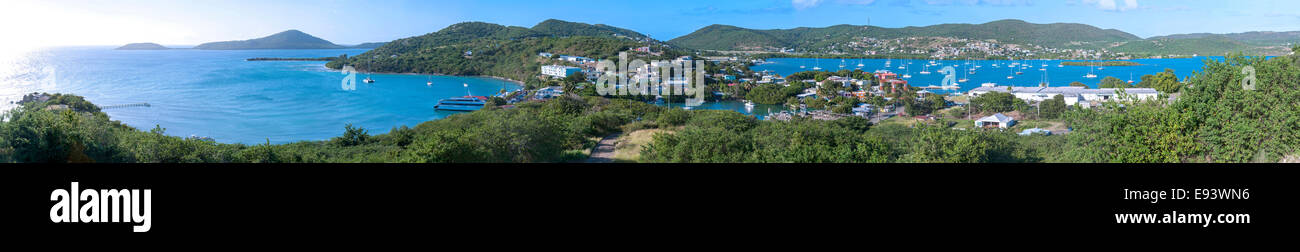 Extremely wide panoramic view of Isla Culebra taken from top of hill south of Dewey and featuring ferry dock, town, Ensenada Hon Stock Photo