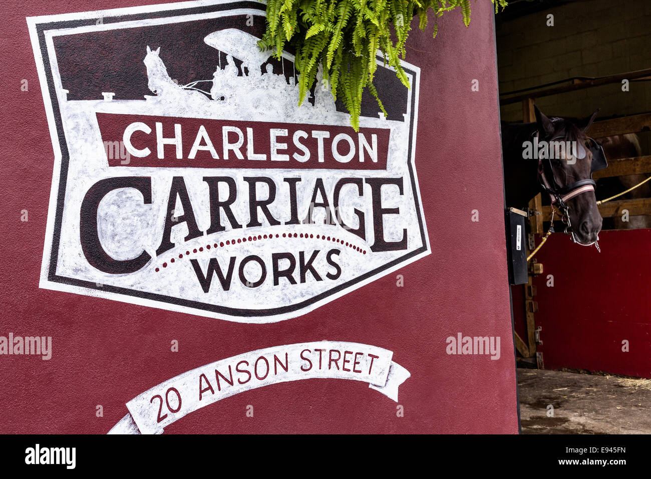 Sign at entrance for Charleston Carriage Works in historic Charleston, SC. Stock Photo
