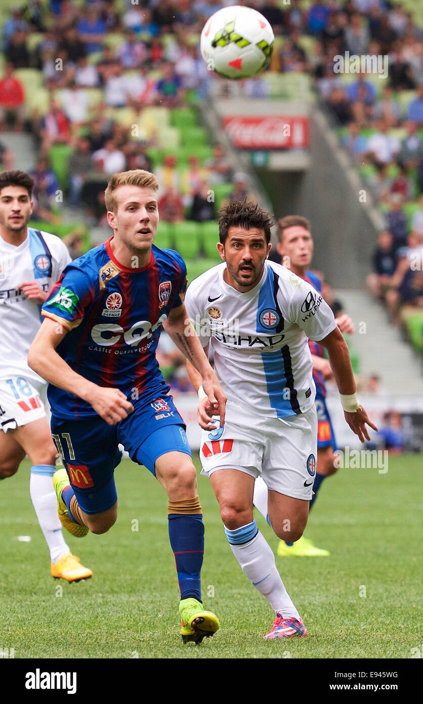 Melbourne, Victoria, Australia. 19th Oct, 2014. ANDREW HOOLE of the Newcastle Jets & DAVID VILLA of the Melbourne City FC compete for the ball during Rd 2 of the 2014/2015 A-League soccer match between Melbourne City FC and the Newcastle Jets at AAMI Park. Credit:  Tom Griffiths/ZUMA Wire/Alamy Live News Stock Photo
