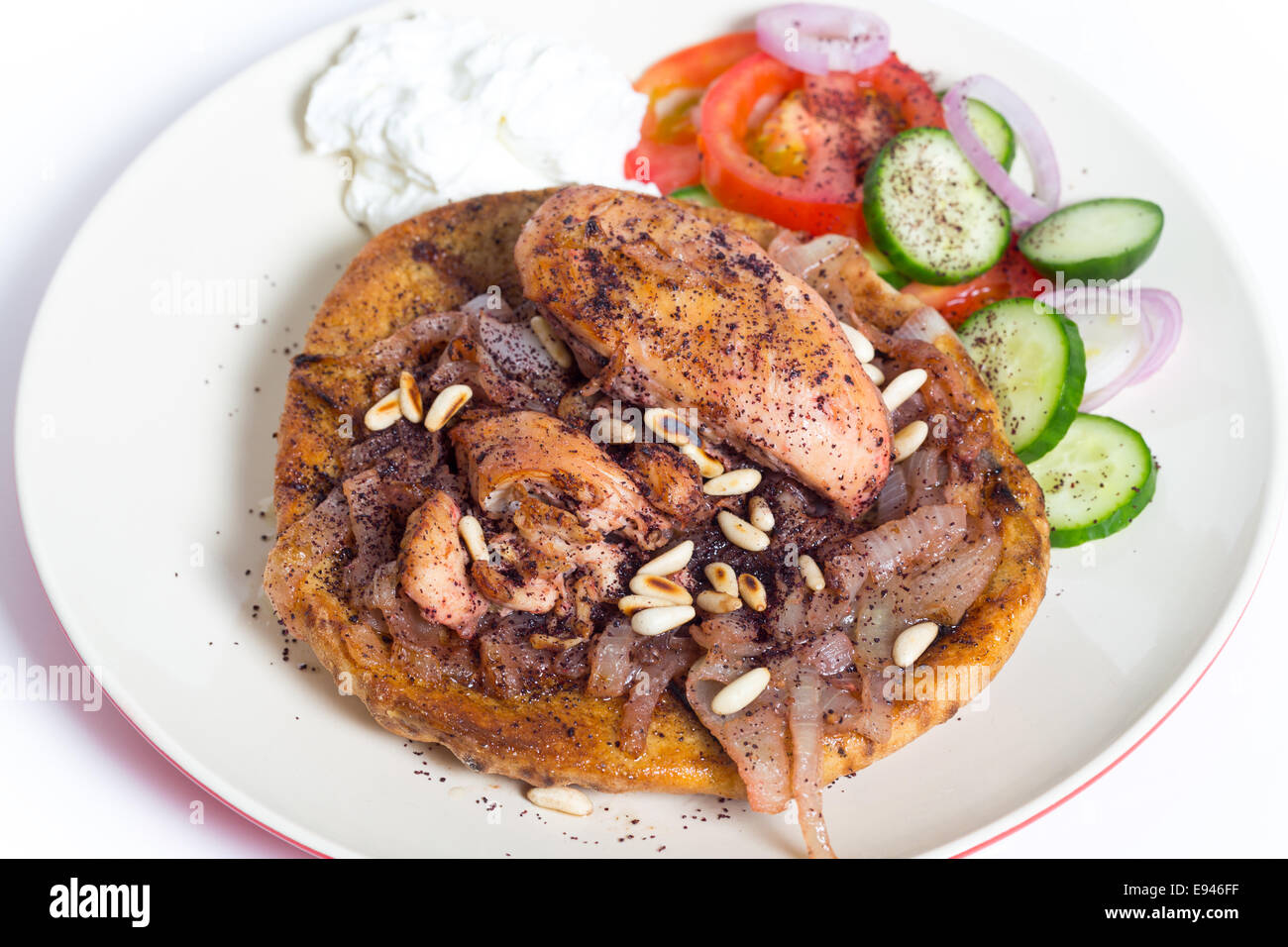 Musakhan, traditional Palestinian sumac chicken, on a plate with a