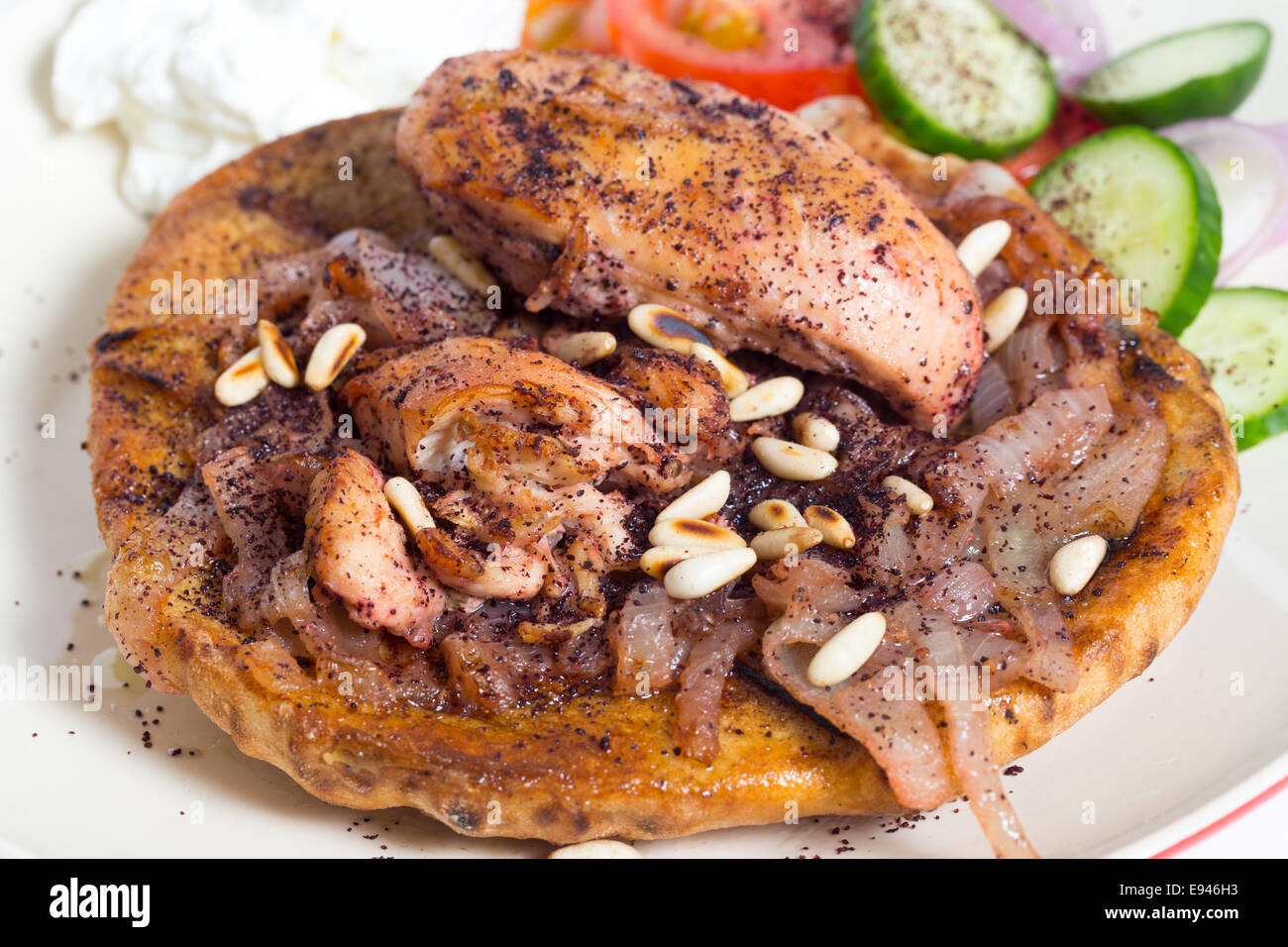 Musakhan, traditional Palestinian sumac chicken, on a plate with a