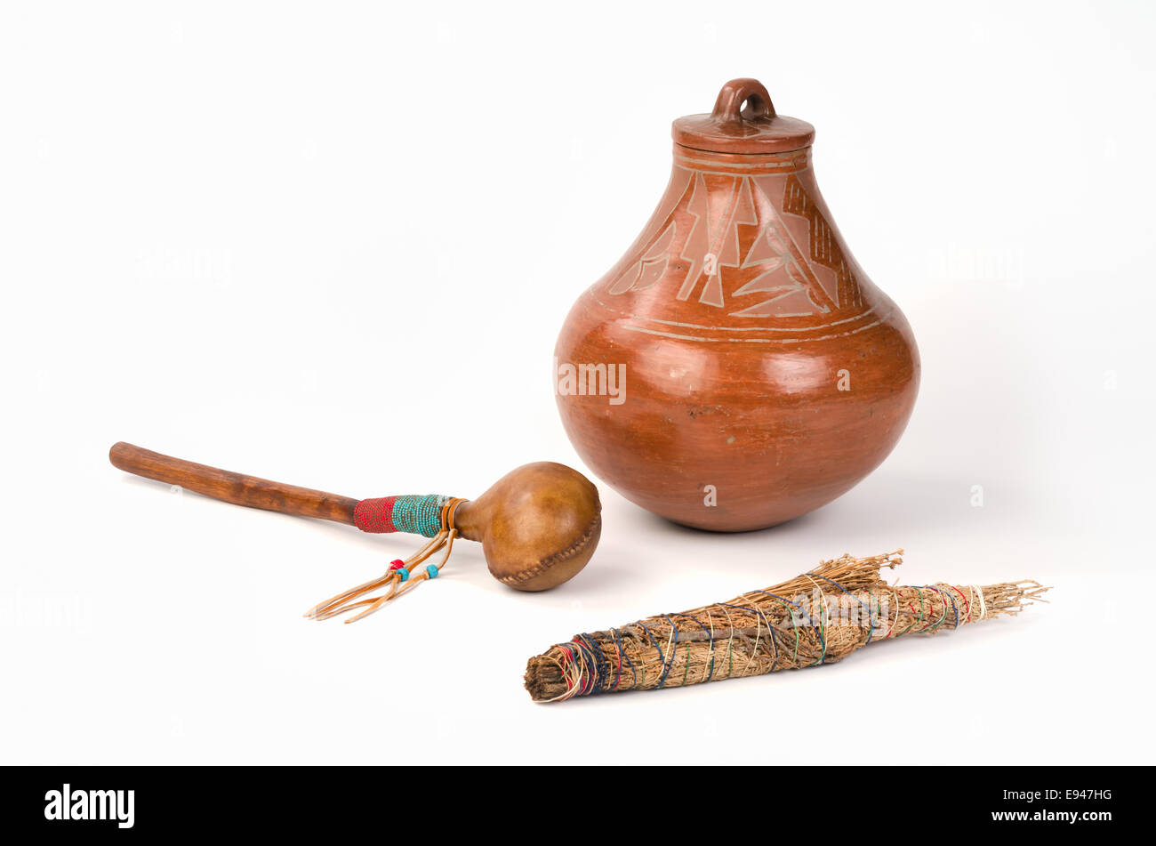 Native American Pueblo Pottery with Smudge Stick and Shaker. Stock Photo