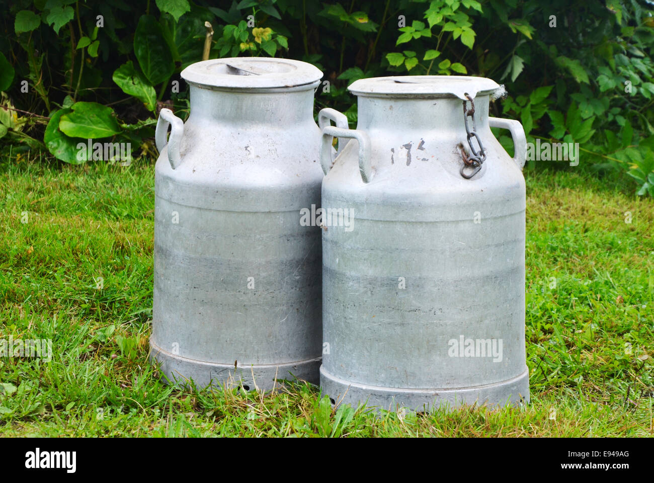 Two old milkcontainers Stock Photo