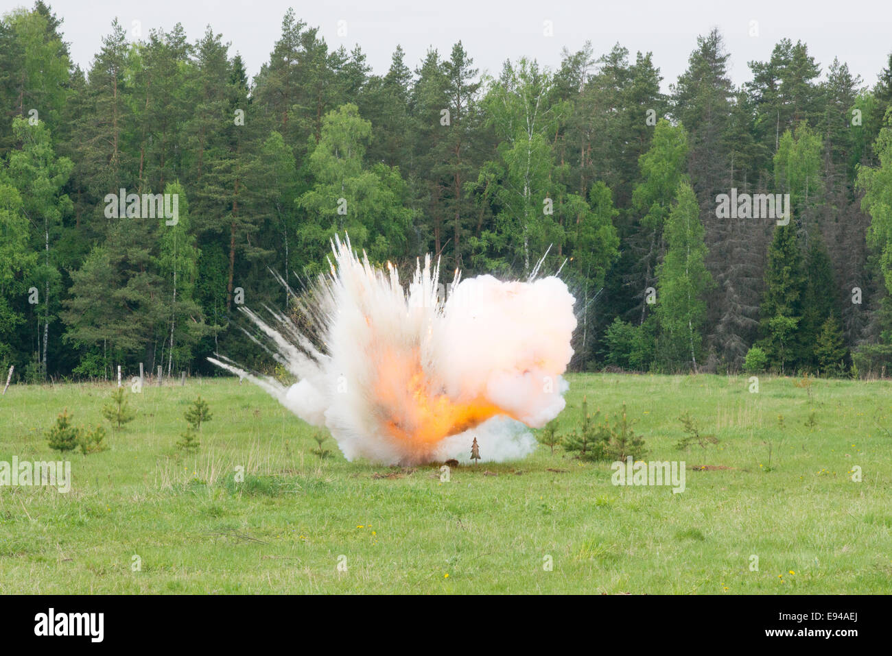 Image of explosion on field during military actions Stock Photo - Alamy