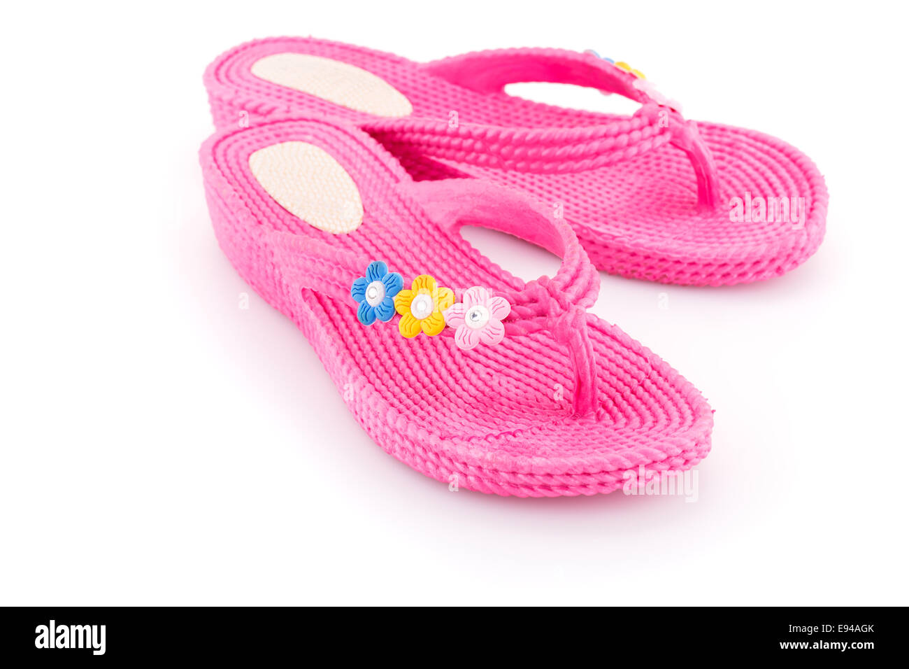 Pink flip flops isolated on white background Stock Photo - Alamy
