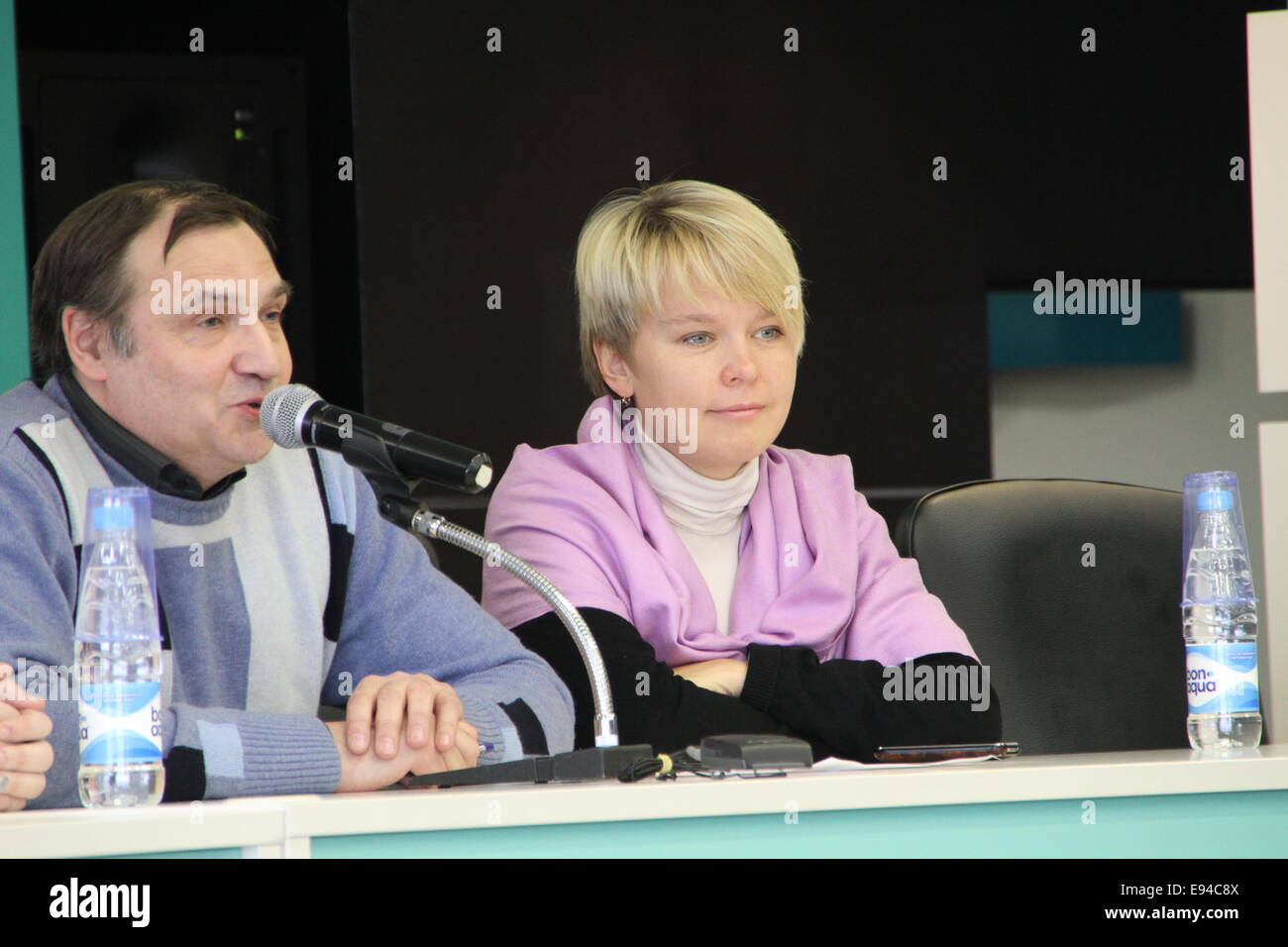 Moscow, Russia - February 11, 2012. Expert Andrei Buzin and policies Evgeniya Chirikova. Conference on the set of observers to t Stock Photo