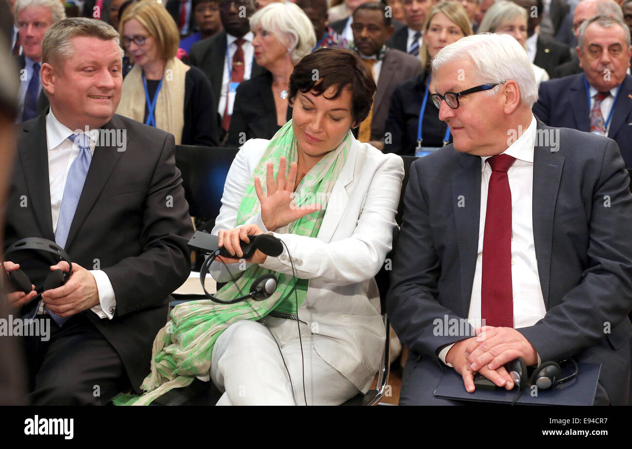Berlin, Germany. 19th Oct, 2014. German Minister of Health Hermann Groehe (CDU, L-R), French minister of state for development Annick Girardin and German Foreign Minister (SPD) participate at the opening of the World Health Summit in Berlin, Germany, 19 October 2014. Representatives of science, economy, politics and civil society discuss the global health care. Central issues are Ebola and possible strategies against the epidemic. Photo: Wolfgang Kumm/dpa/Alamy Live News Stock Photo