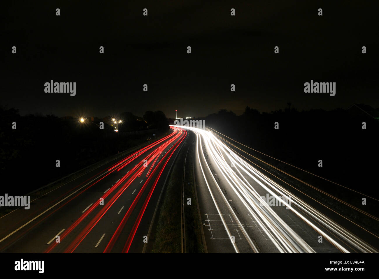 Motorway light trails, cars stream up and down a British motorway Stock Photo