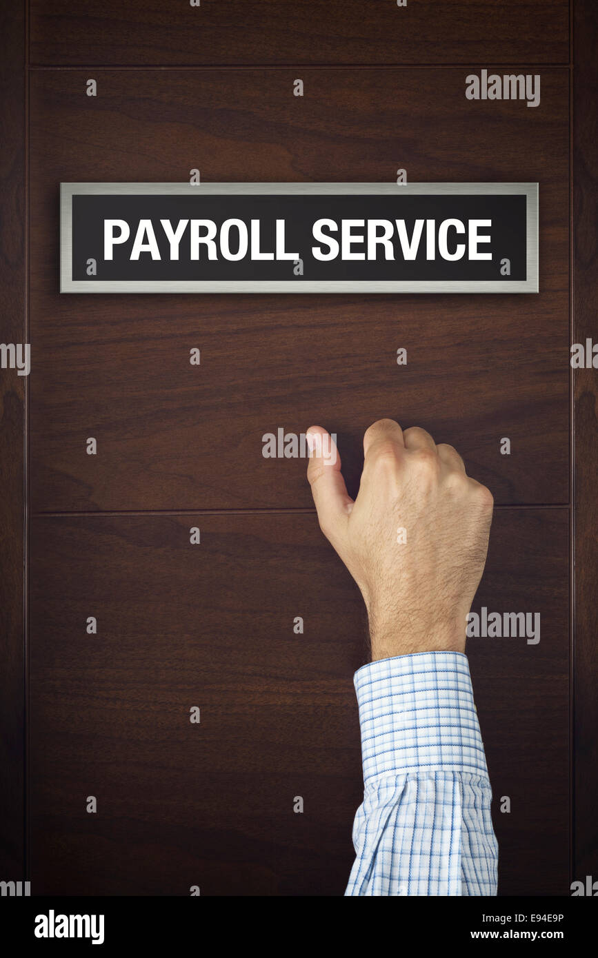 Businessman is knocking on Payroll service bureau door, conceptual image Stock Photo