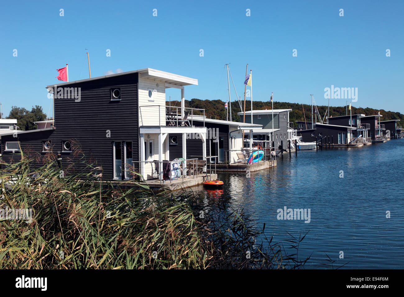 Floating holiday apartments at the IM Jaich resort village, Lauterbach on Rugen Island. Stock Photo