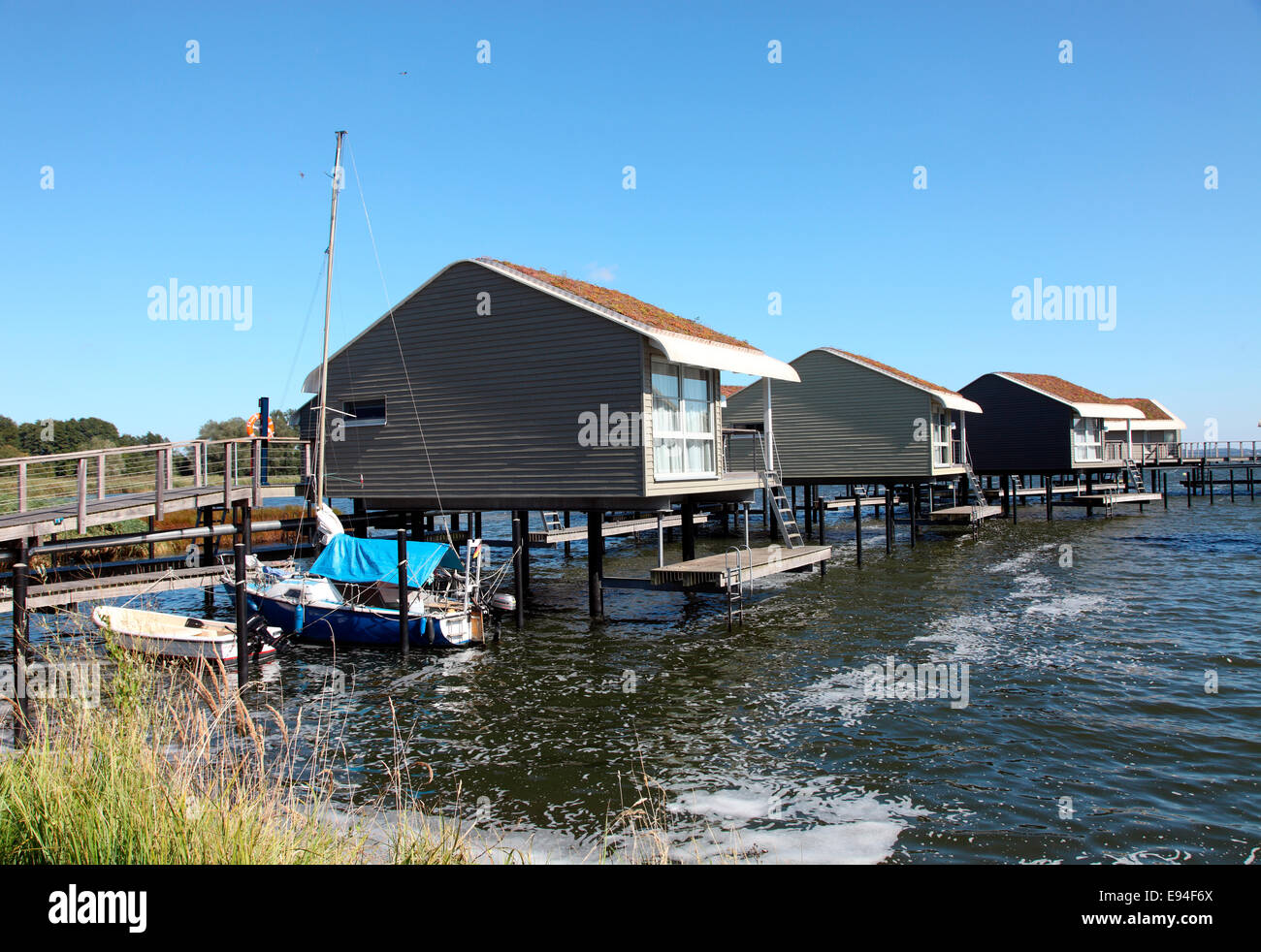 holiday homes on stilts at the IM Jaich resort village, Lauterbach, Rugen Island. Stock Photo