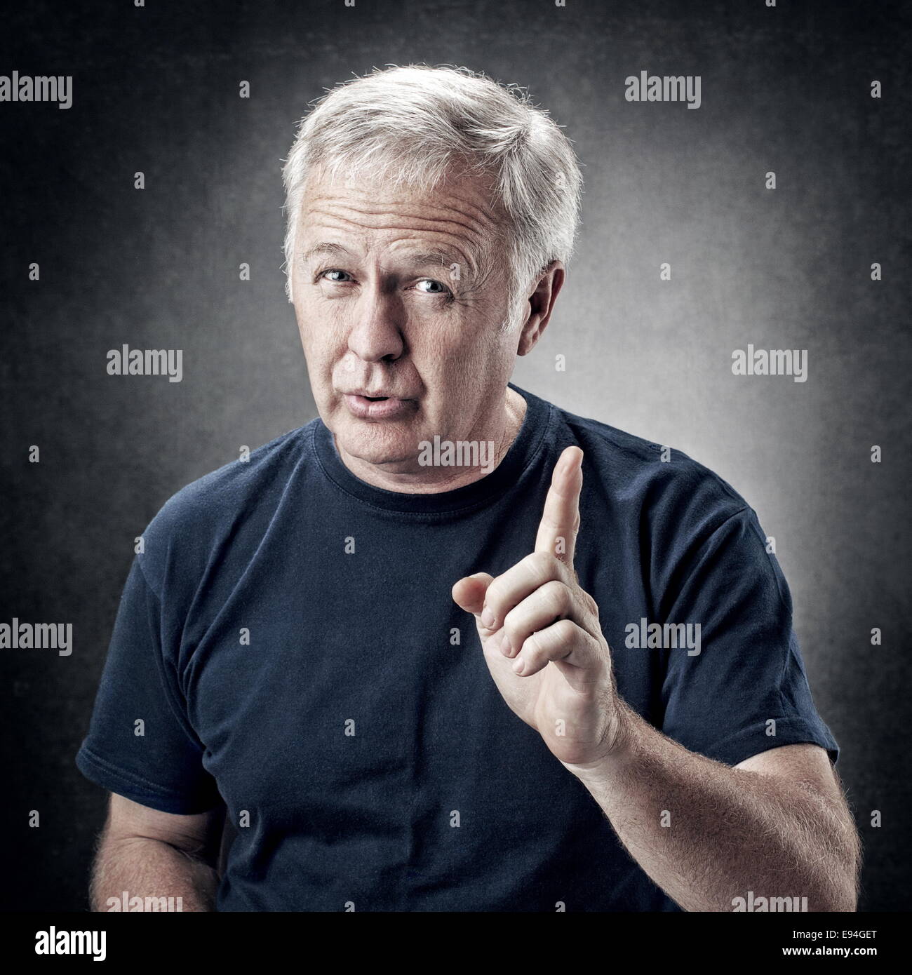 Old man emphasizing an idea for someone Stock Photo