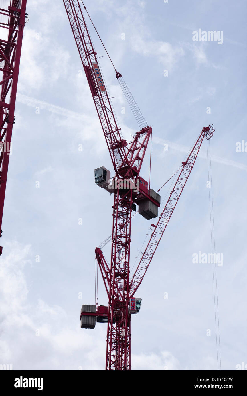 Close-up of red cranes on the construction site of 'Victoria Circle', Land Securities development of Victoria, London, UK Stock Photo