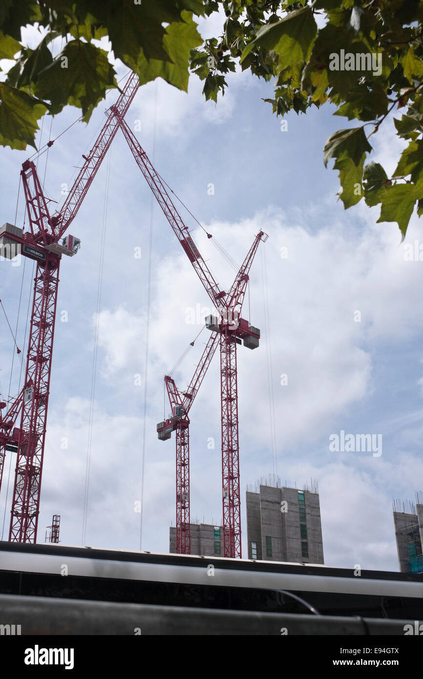 Red cranes on the construction site of 'Victoria Circle', Land Securities new buildings development of Victoria, London, UK Stock Photo