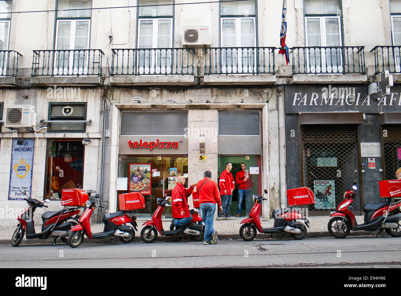 Telepizza pizza service with red scooters in Pombaline Lower Town Baixa Pombalina Lisbon Portugal Stock Photo