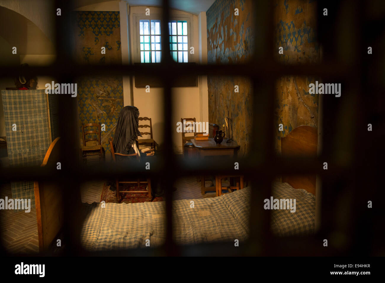 View through the guards viewing window to Marie Antoinette's recreated cell at the Conciergerie, Paris, France Stock Photo