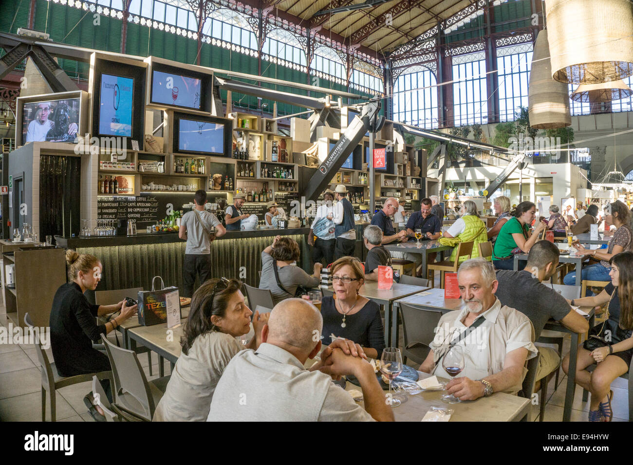 bar & crowded seating area of food court on upper floor inside magnificent Victorian cast iron structure Central Market Florence Stock Photo