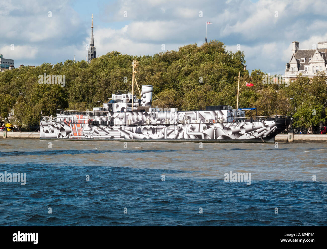 HMS President (HQMS President (1918)), moored on the River Thames, Victoria Embankment, London, one of three surviving WW1 warships, painted in a dazzle design Stock Photo