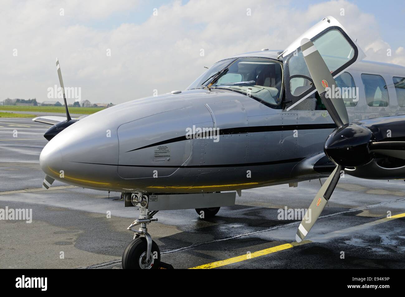 Front side view of a Piper Chieftain twin-engined aircraft sitting on a tarmac air strip Stock Photo