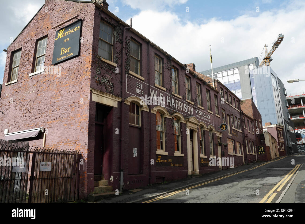 W E Harrisons steeplejack Building in Sheffield city centre England now Harrisons Bar, Building conversion listed industrial building Stock Photo
