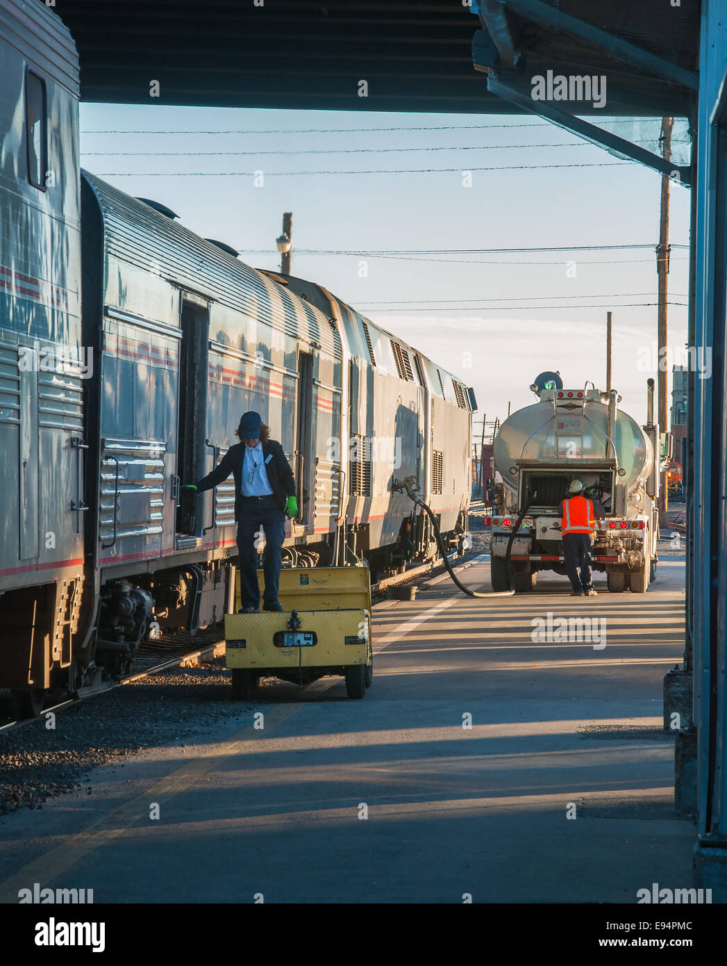 Passenger train to LA stops for fuel and baggage Stock Photo Alamy