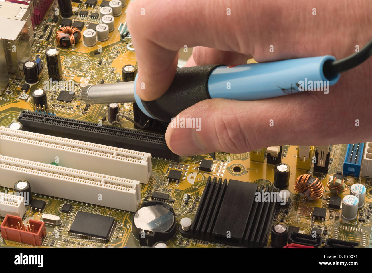 Soldering a circuit board Stock Photo Alamy