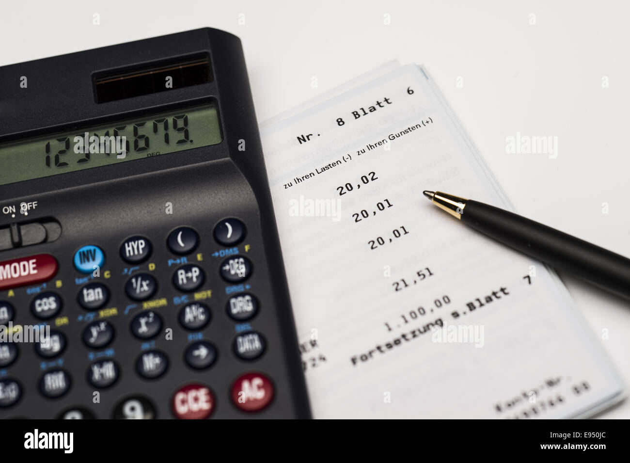 Calculator is located on a bank statement Stock Photo