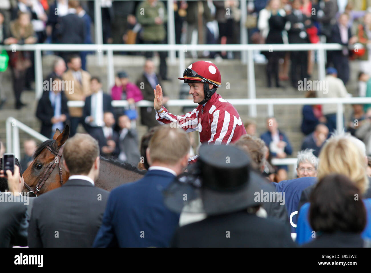 18.10.2014 - Ascot; Winners presentation with Charm Spirit, ridden by Olivier Peslier after winning the Qipco British Champions Fillies and Mares Stakes (Group 1). Olivier Peslier salutes the crowd. Credit: Lajos-Eric Balogh/turfstock.com Stock Photo