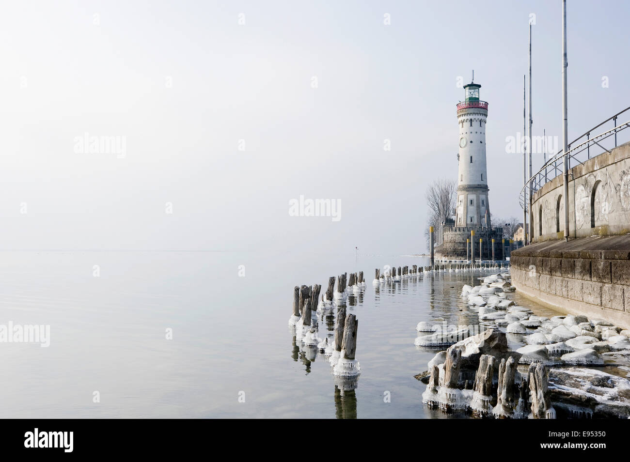 Lindau Lighthouse and frozen Lake Constance, Lindau, Bavaria, Germany Stock Photo