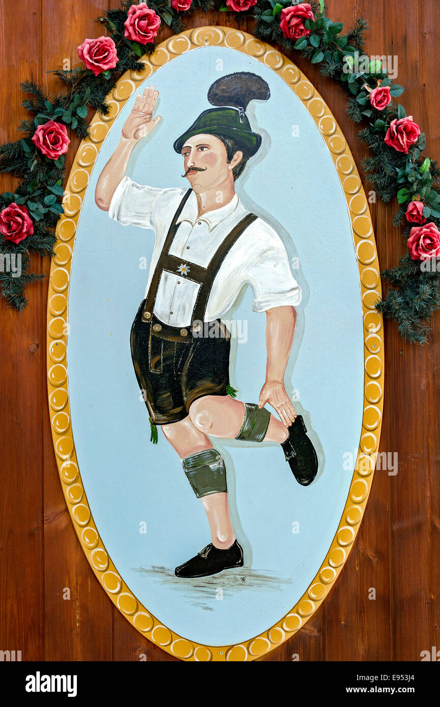 Man dancing the Schuhplattler in Bavarian dress, painted on a wooden board, Echelsbach, Upper Bavaria, Bavaria, Germany Stock Photo