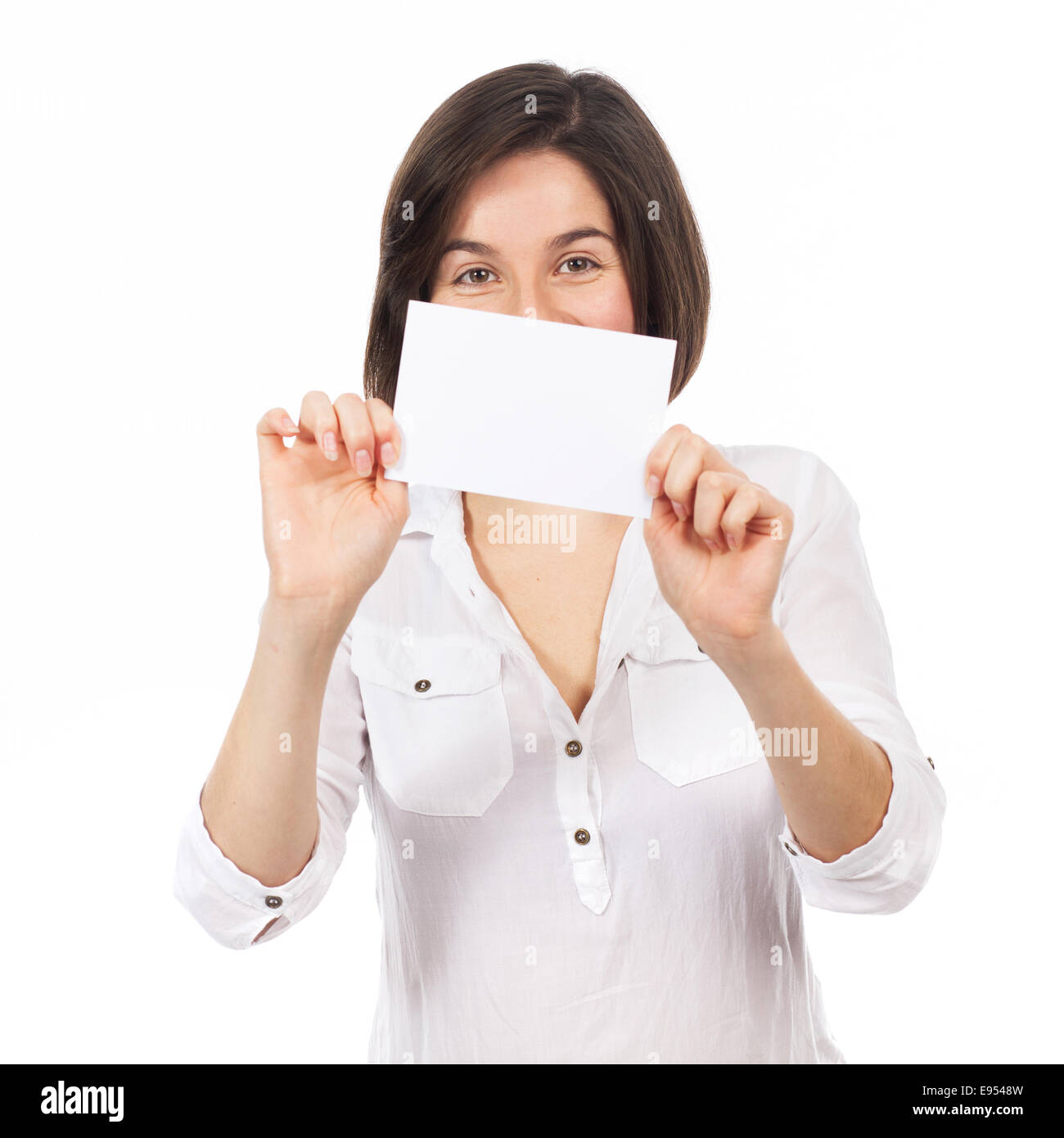 Pretty brunette presenting a white signboard, isolated on white Stock Photo