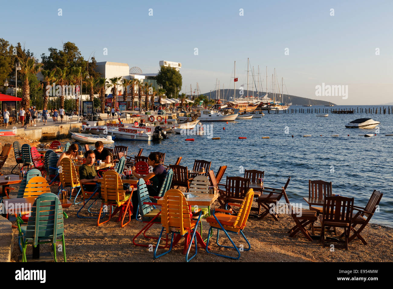 Kumbahce bay with Halicarnassus Club, tables and chairs on the beach, Bodrum, Mugla, Aegean Region, Turkey Stock Photo