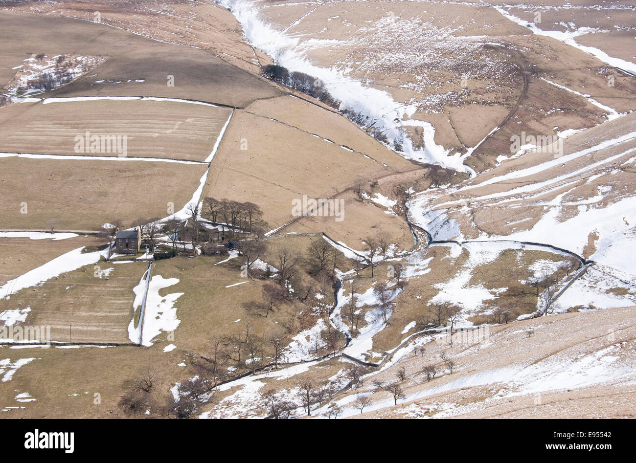 Farmhouse seen from high viewpoint with late winter landscape in the High Peak, Derbyshire. Stock Photo
