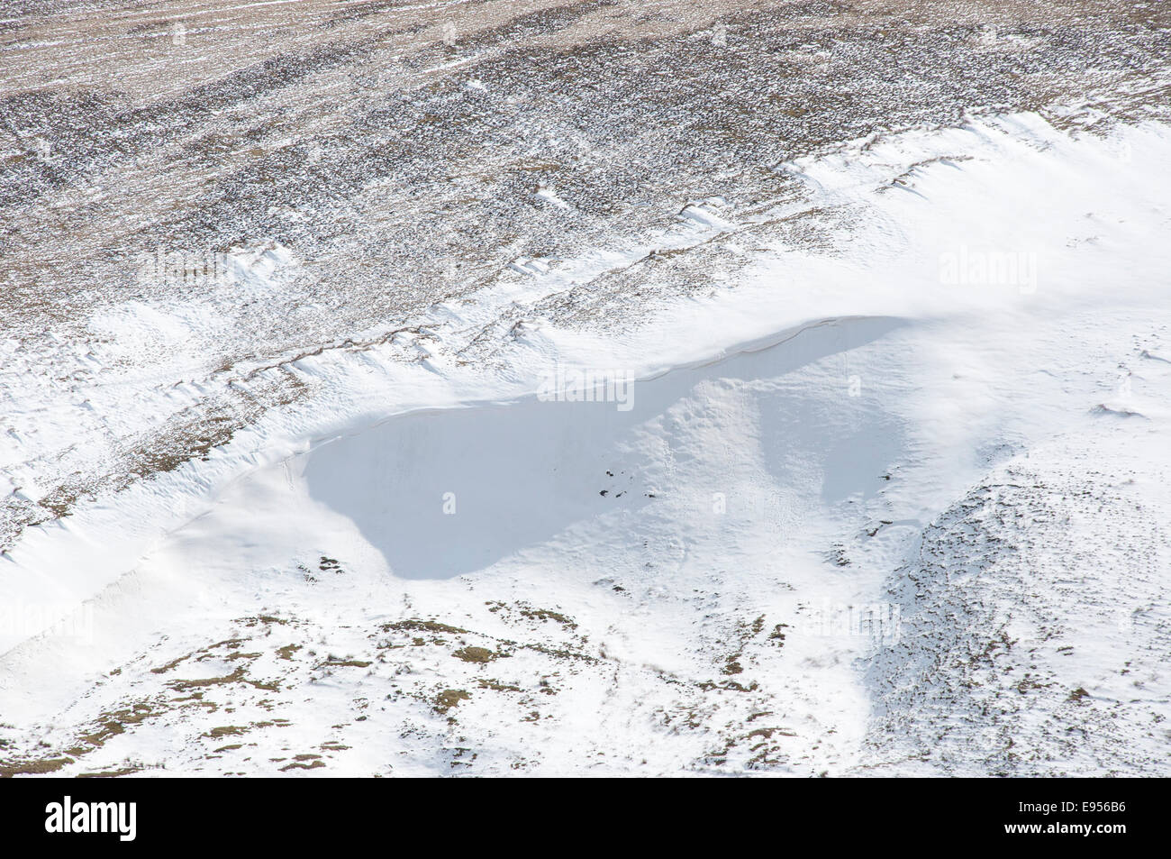 Massive Snowdrift on a moorland hillside near Hayfield in Derbyshire. Stock Photo